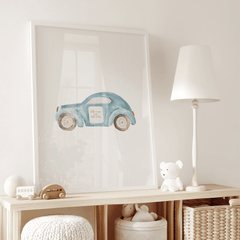 Blue car nursery print on a shelf beside a lamp and plush toys