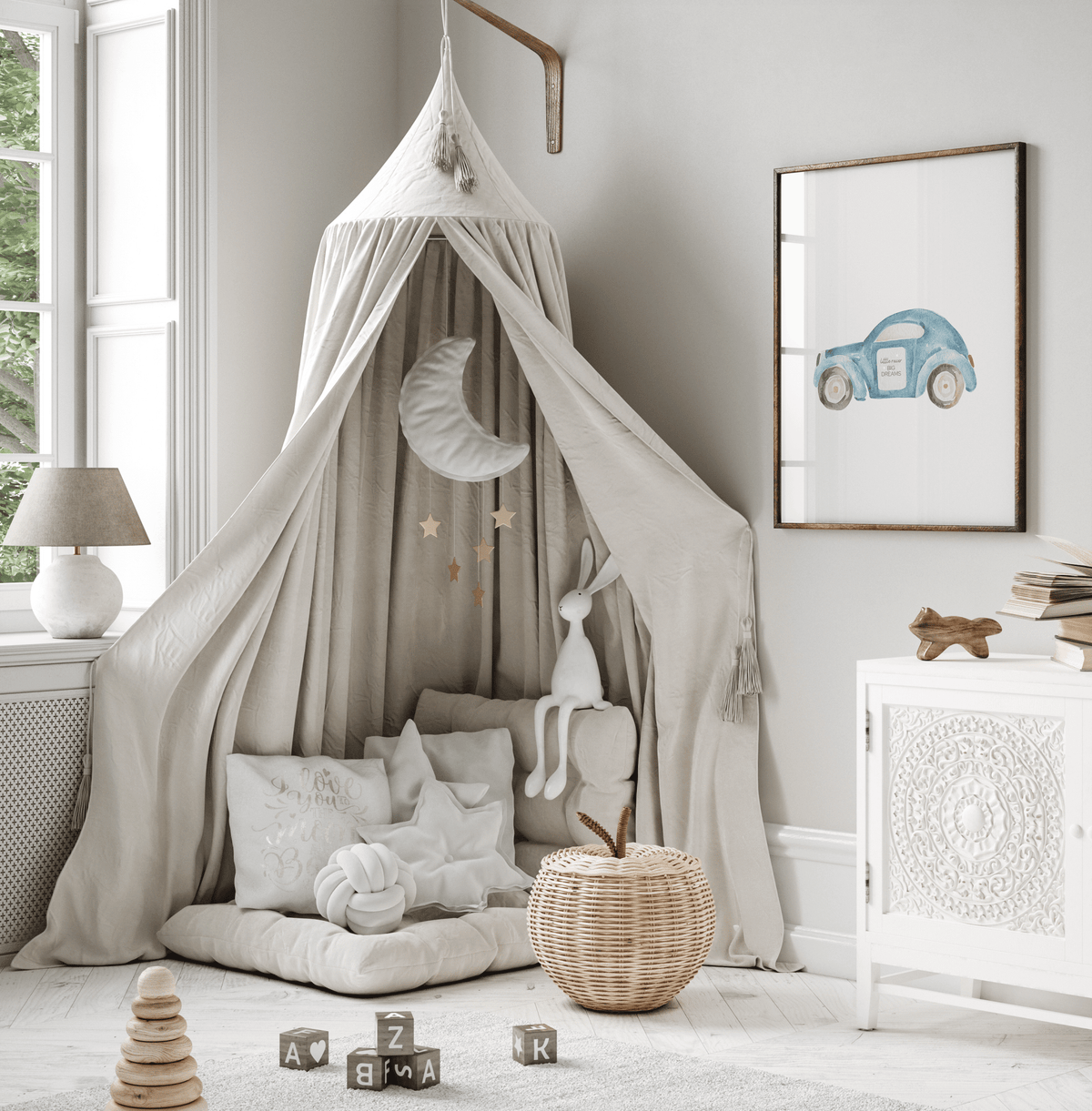 Blue car nursery print beside a canopy play nook in a neutral kids room