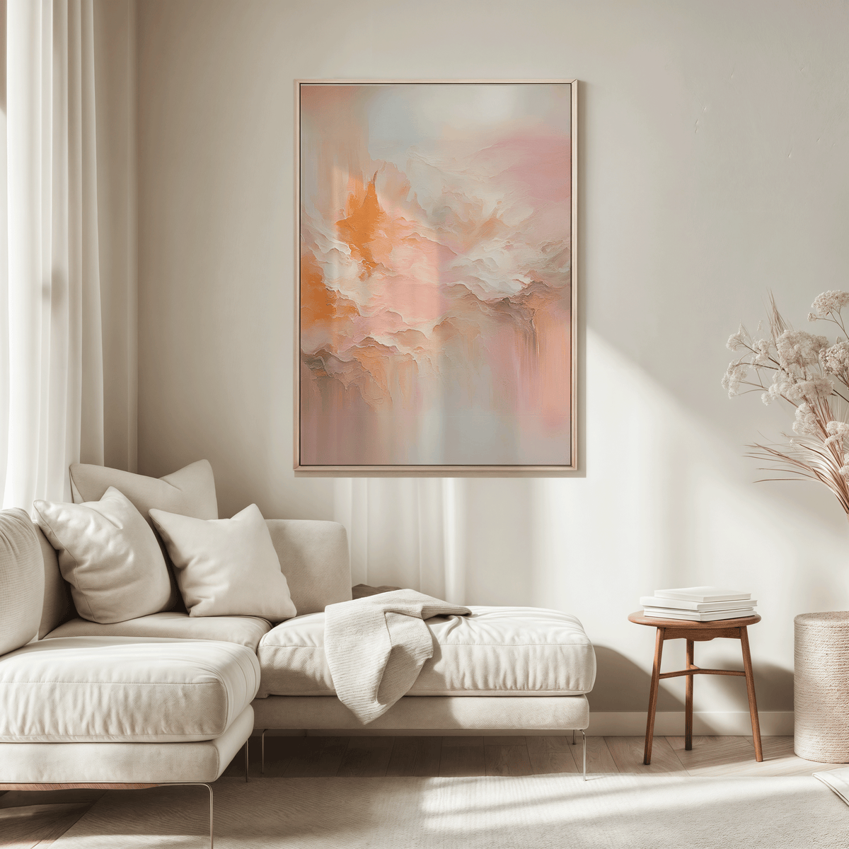 Large blush pink and peach abstract wall art framed in wood above sectional sofa in  neutral living room