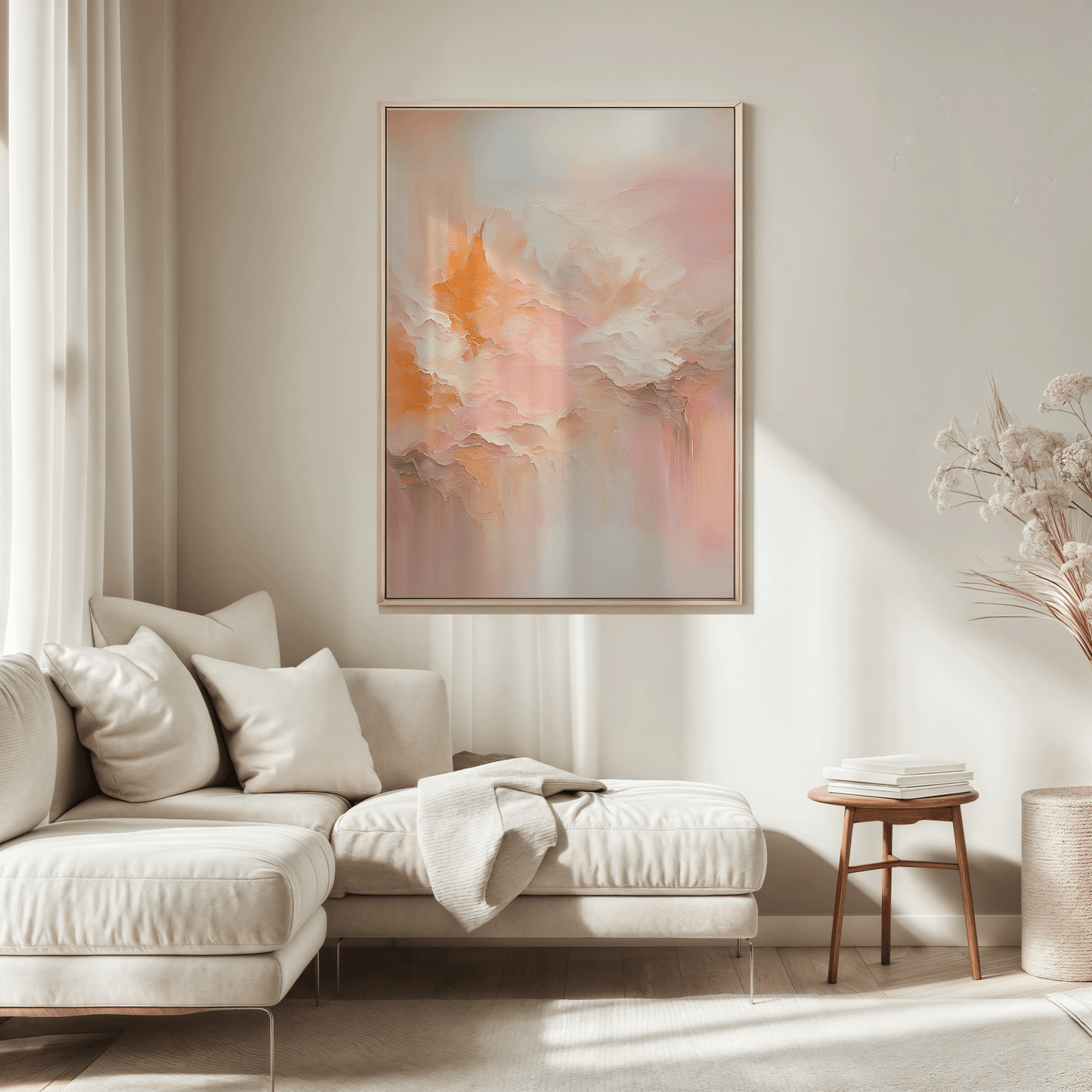 Large blush pink and peach abstract wall art framed in wood above sectional sofa in  neutral living room