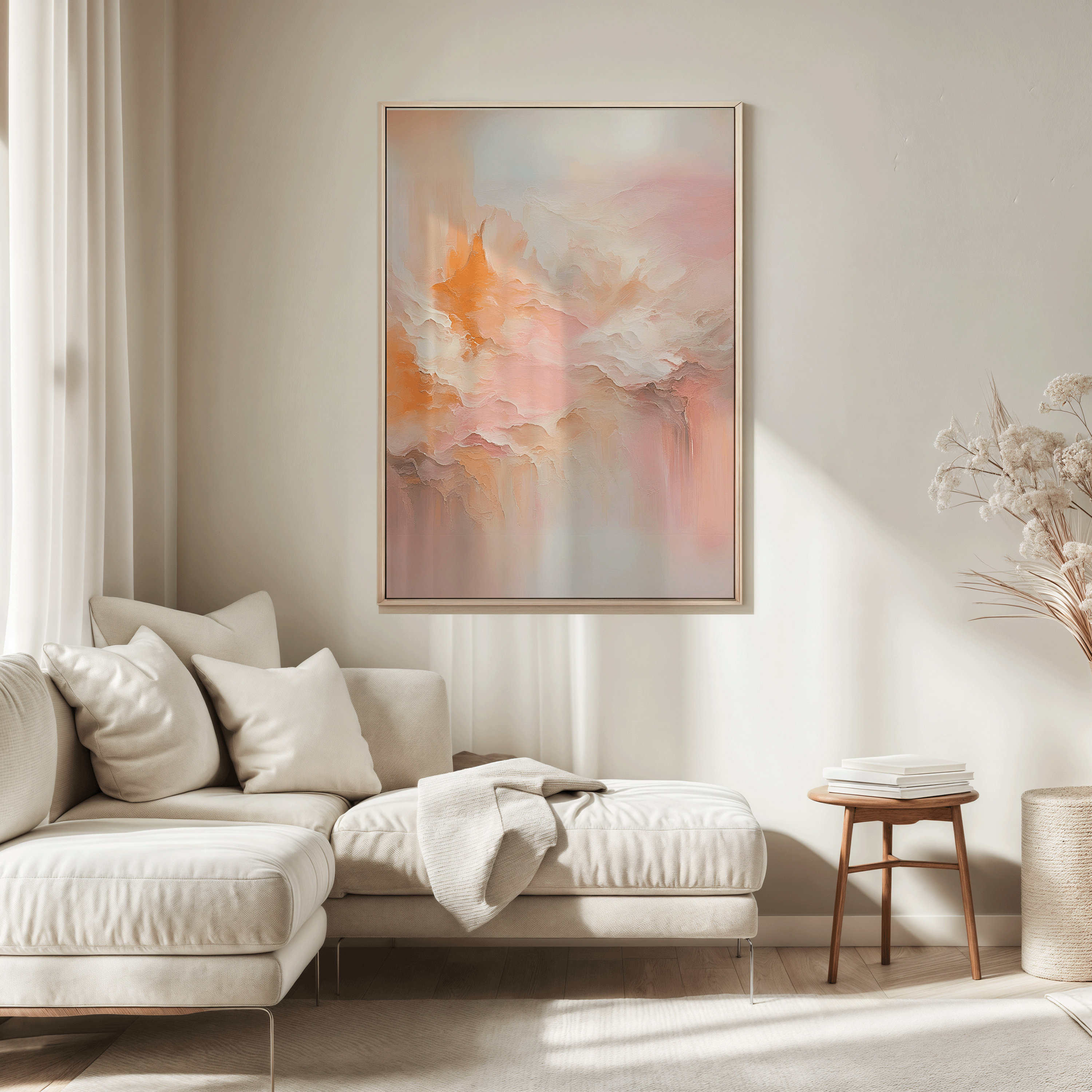 Large blush pink and peach abstract wall art framed in wood above sectional sofa in living room