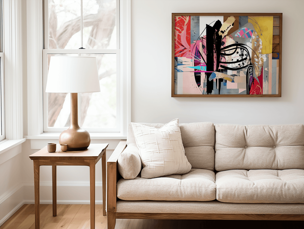 Framed bold artistic colorful abstract wall art print with a brown wooden frame above a cream tufted couch in a neutral living room with wood accents.