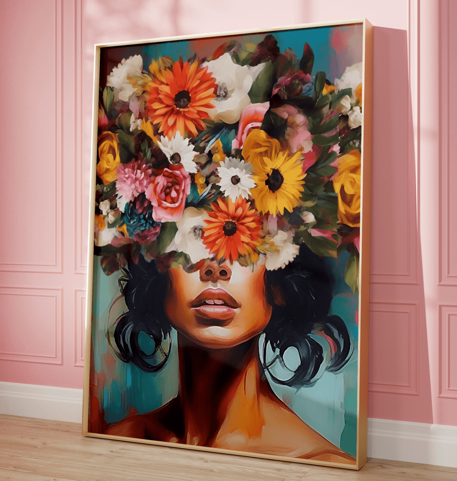 Colorful floral woman portrait wall art print with bold flower crown on framed canvas leaning against pink wall.