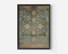 Large floral patterned black-framed wall art with blue and beige textile design on a white background