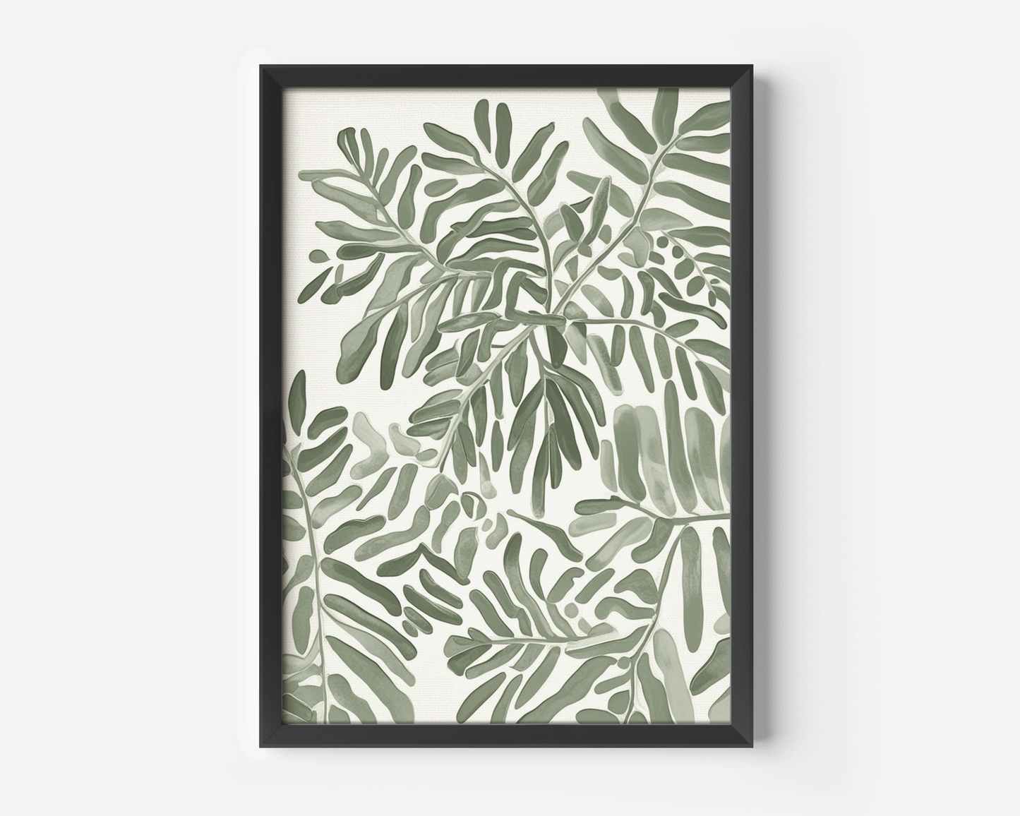 Neutral botanical leaf wall art shown as a single black framed print, featuring layered soft green leaves on a light neutral background with a modern contrast frame