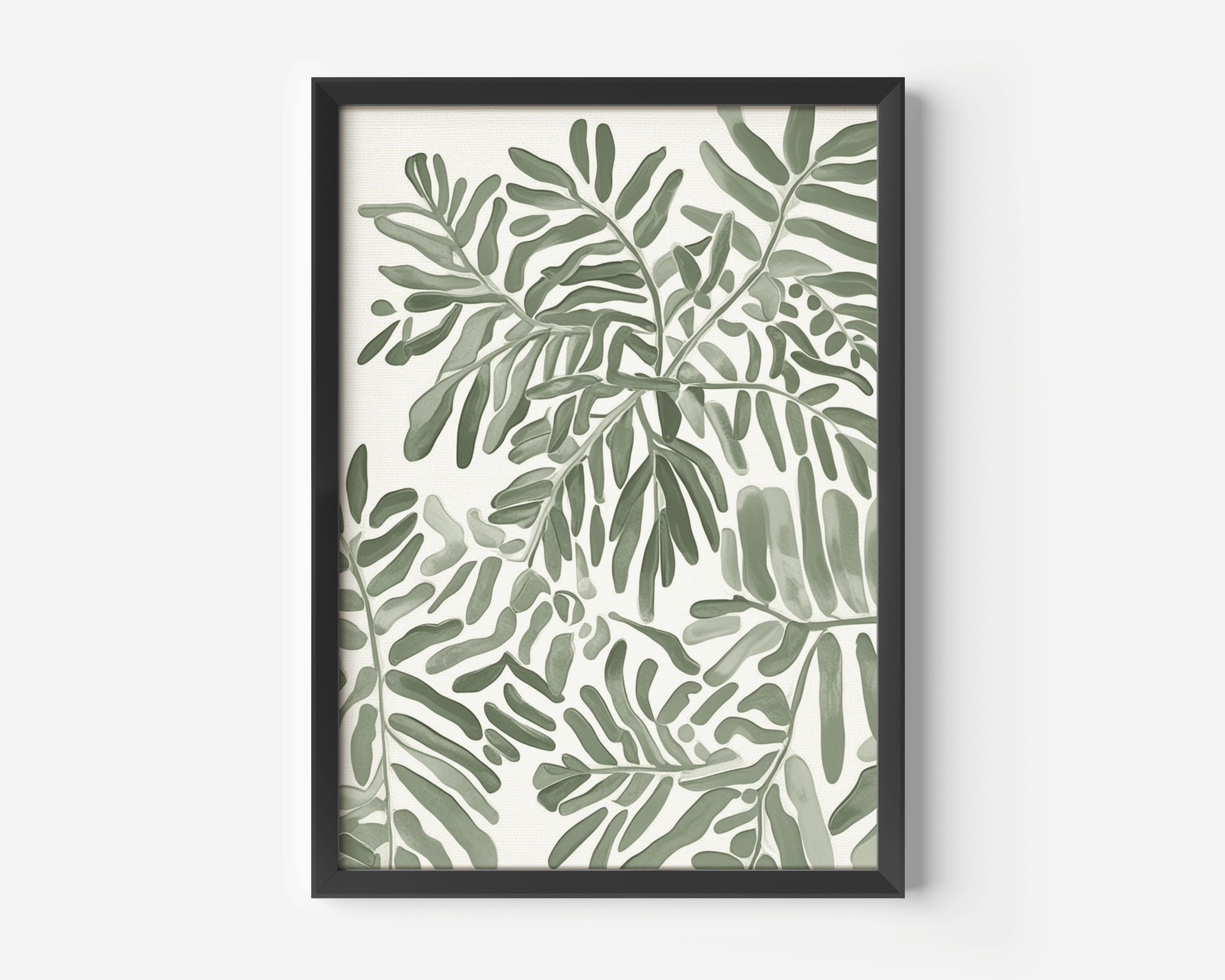 Neutral botanical leaf wall art shown as a single black framed print, featuring layered soft green leaves on a light neutral background with a modern contrast frame