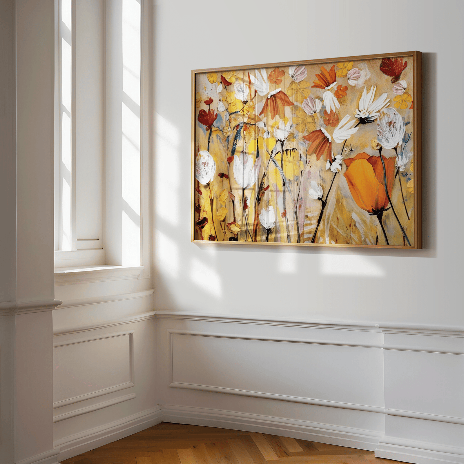 Framed warm floral wall art print with yellow, orange, and cream tones and a light brown wooden frame on a white wall in a hallway