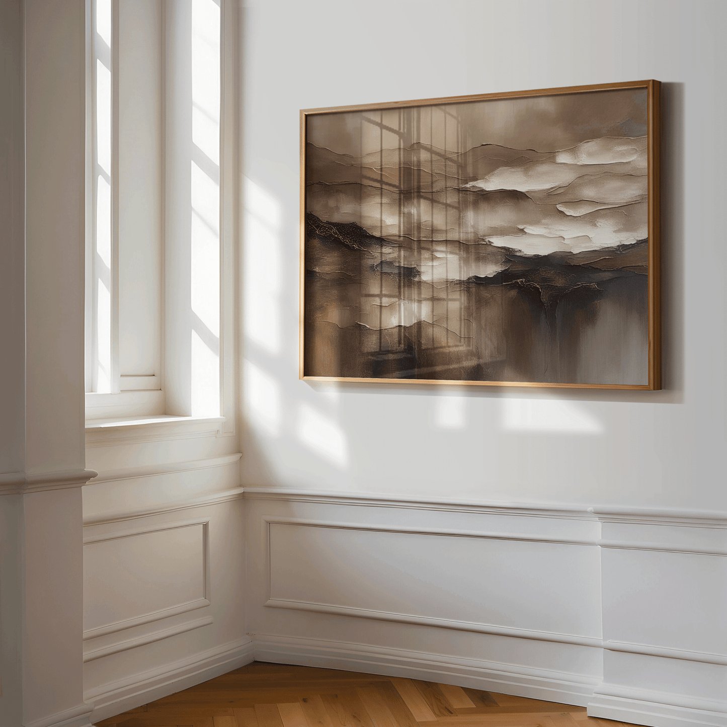 Brown abstract wall art in a wood frame on a sunlit panelled wall