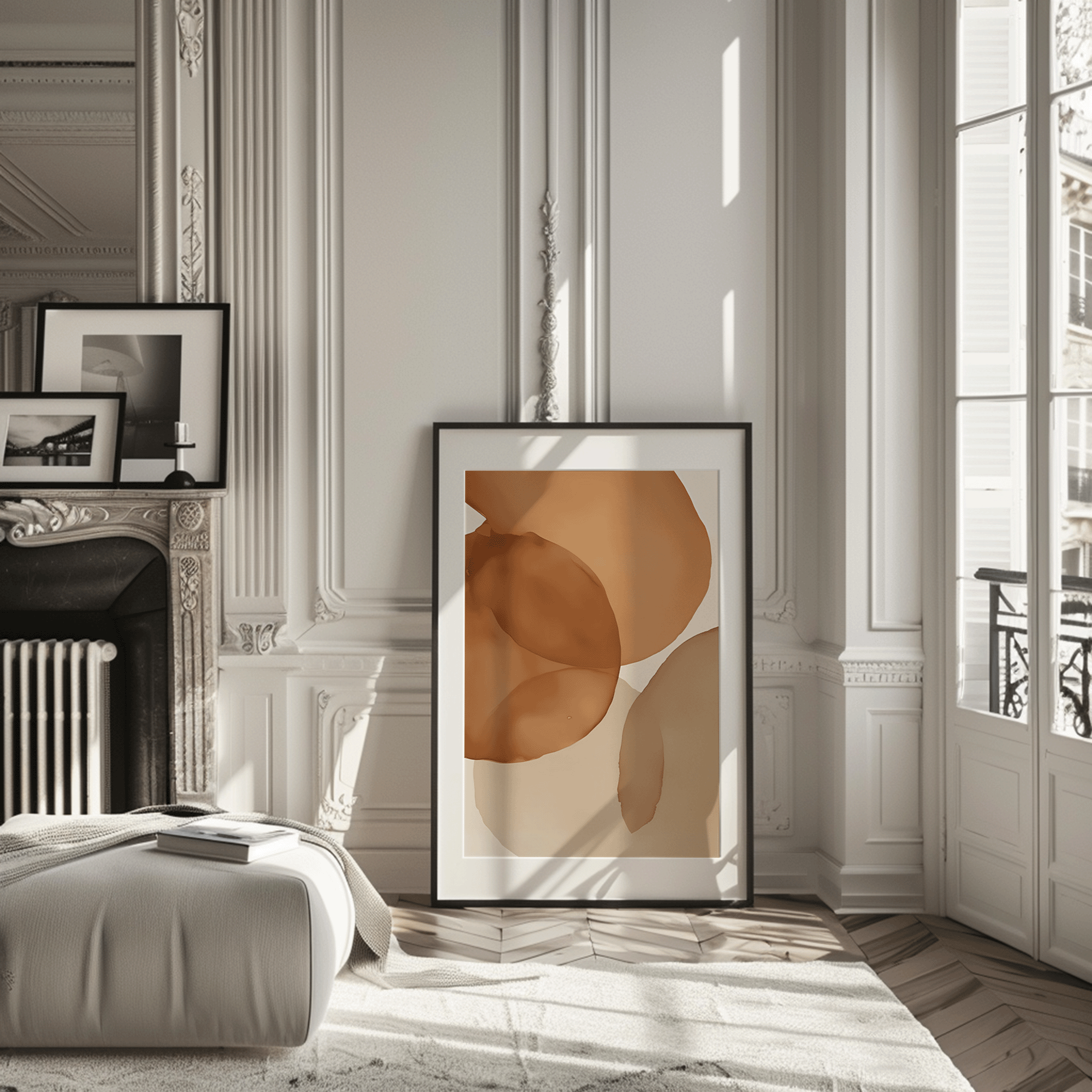 Large terracotta watercolor abstract framed wall art print leaning in elegant, modern Parisian style room. Artwork has a mix of warm orange, brown, beige and cream tones.