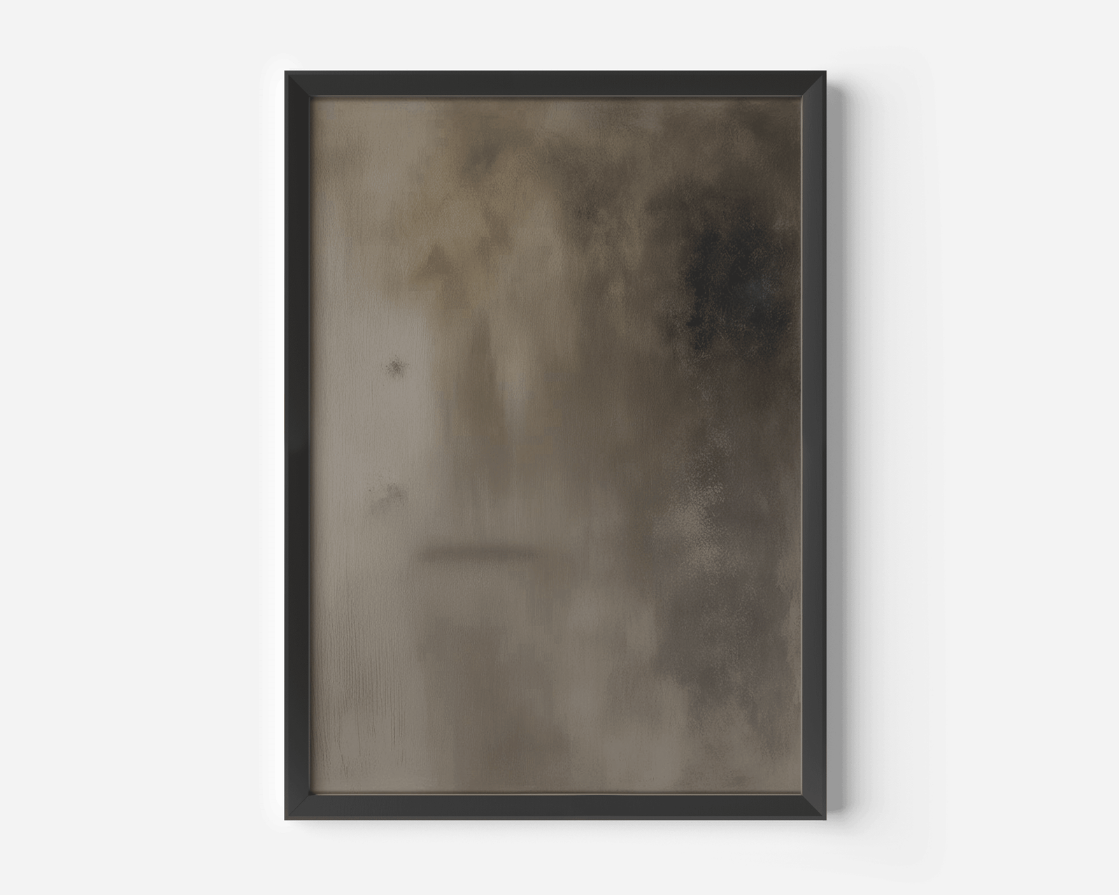 Close-up of moody brown earthy abstract wall art in black modern frame against a white wall