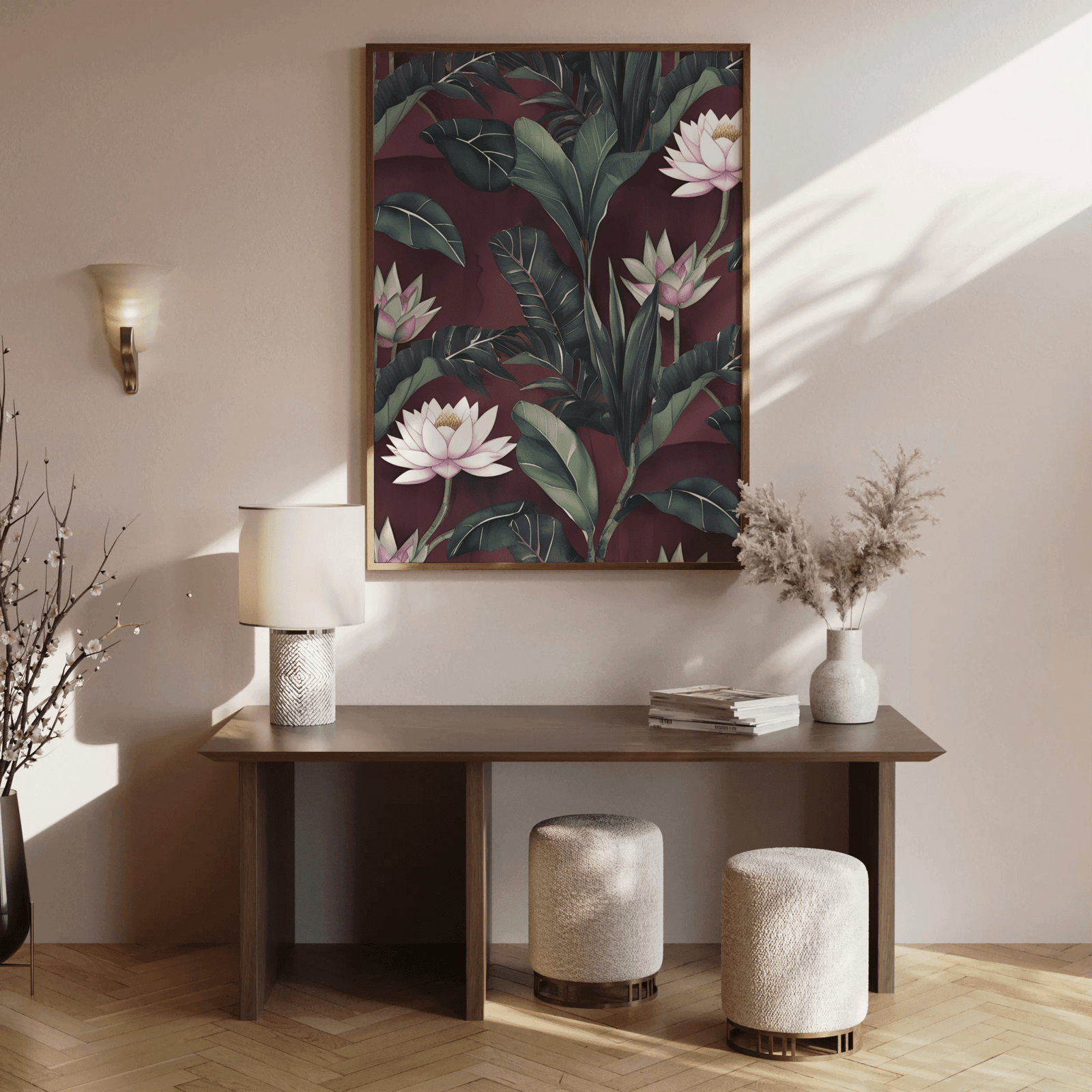 Burgundy lotus wall art in a wood frame above a console table in a sunlit entryway