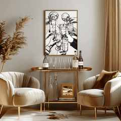 Cheers cocktail print in a natural frame above a gold bar cart between two cream armchairs
