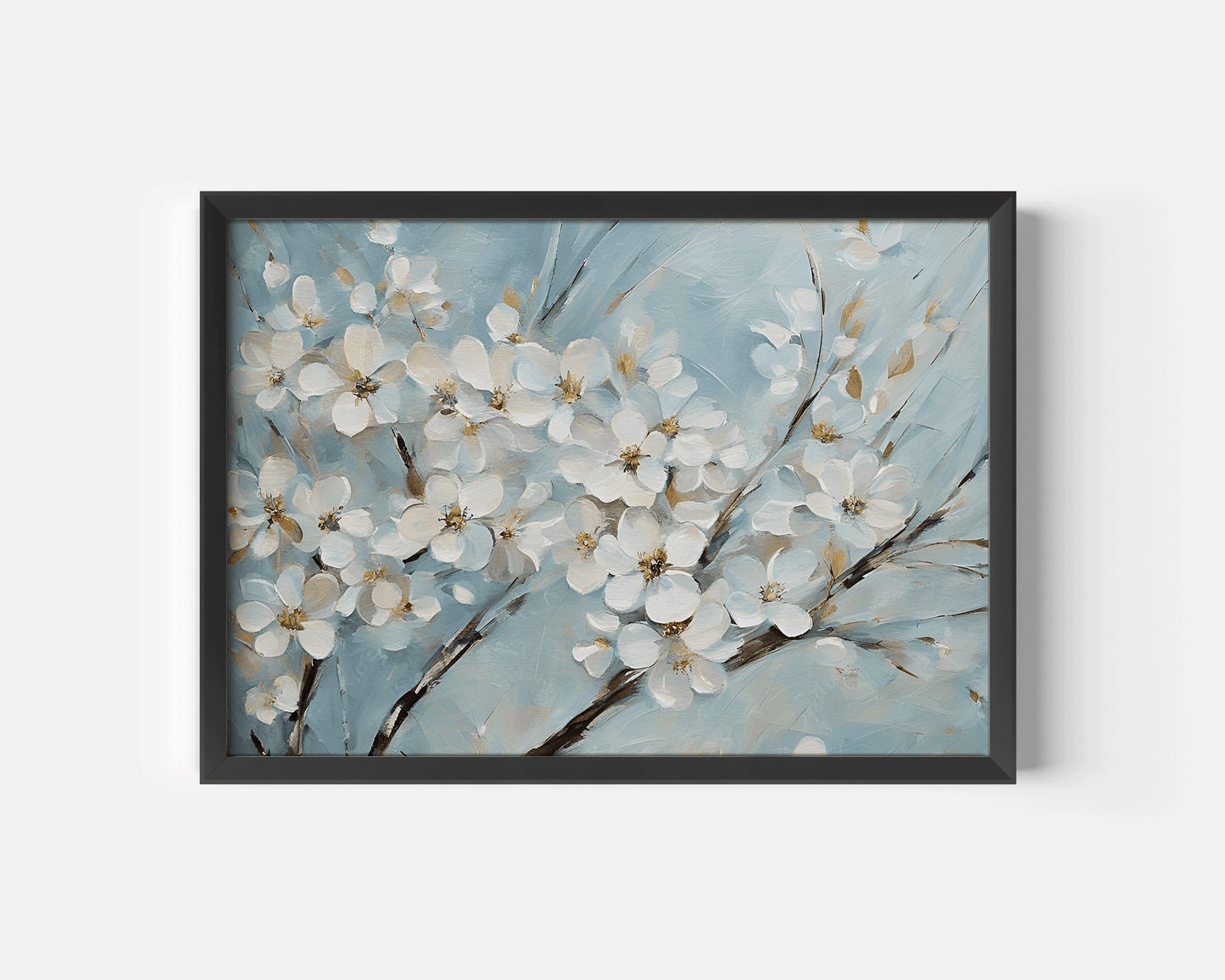 Close-up of cherry blossom wall art showing white flowers on soft blue background in a modern black frame.