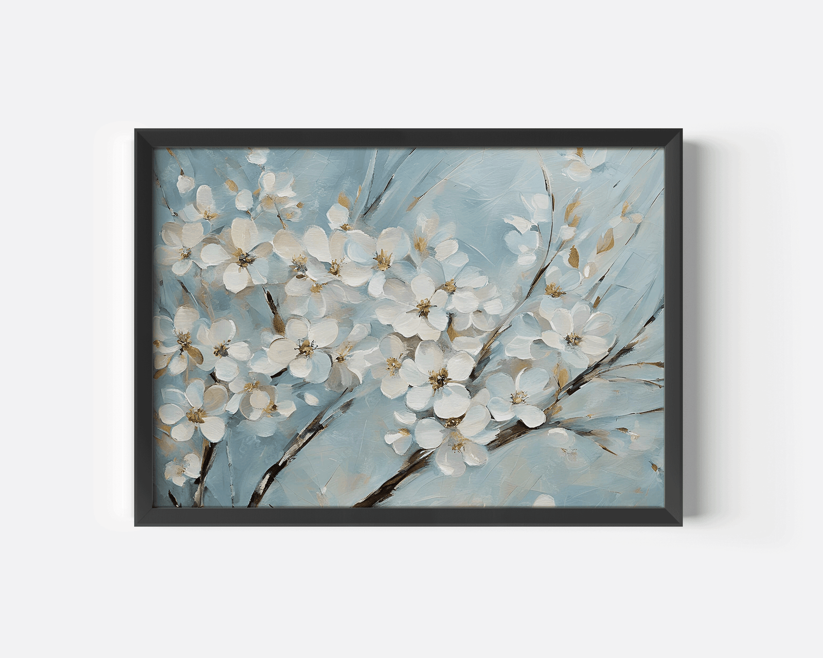 Close-up of cherry blossom wall art showing white flowers on soft blue background in a modern black frame.