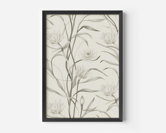 Close-up of black-framed canvas wall art with white lotus flowers and muted sage leaves in an abstract design