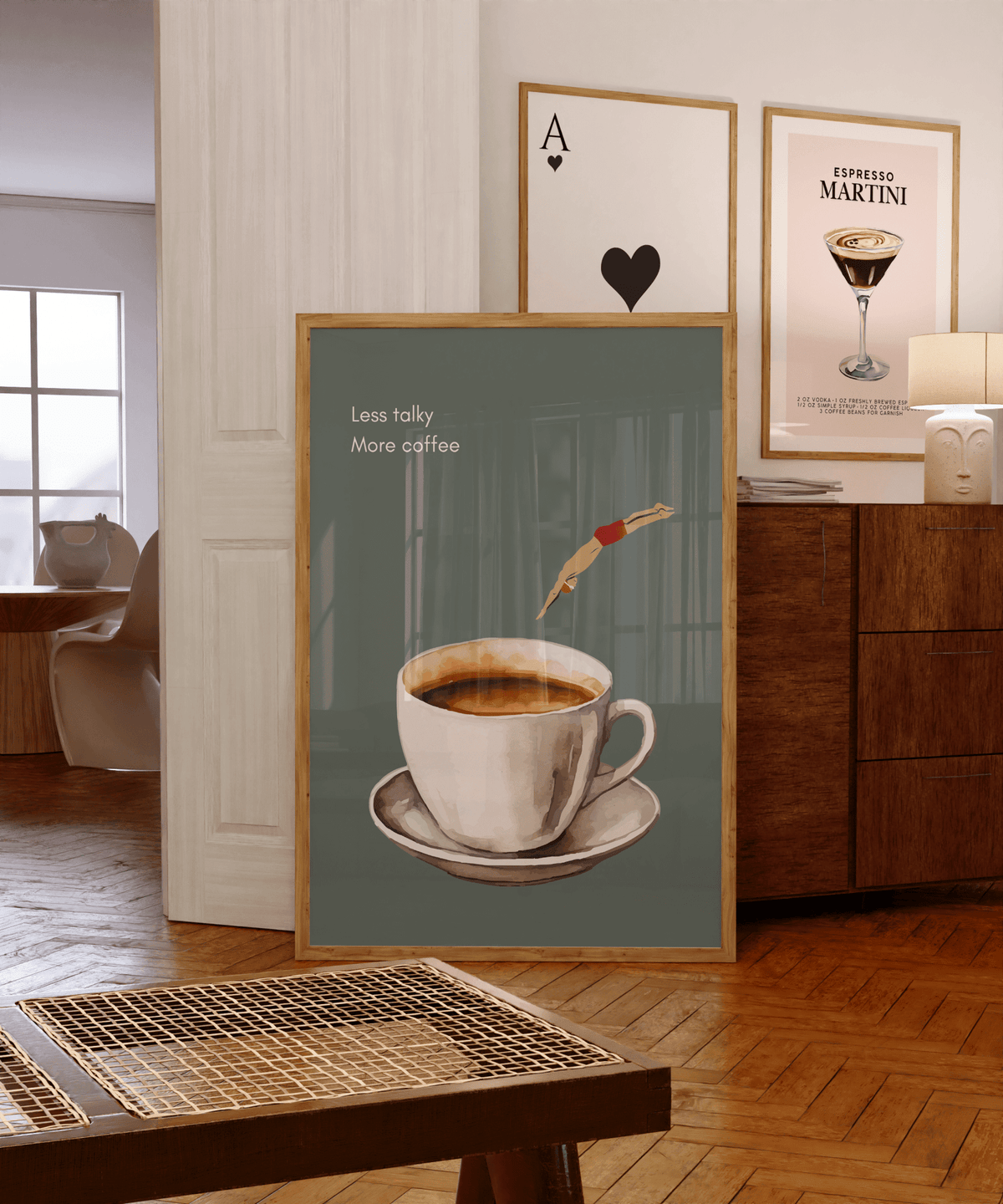 Sage green coffee print in a natural frame on a wooden bar cart beside espresso martini and playing card prints