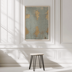 Cracked blue and gold print on a white panelled wall above a small stool