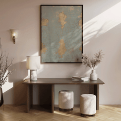 Cracked blue and gold print above a dark wood console with a lamp and stools