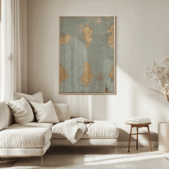 Cracked blue and gold print above a cream sofa in a bright living room