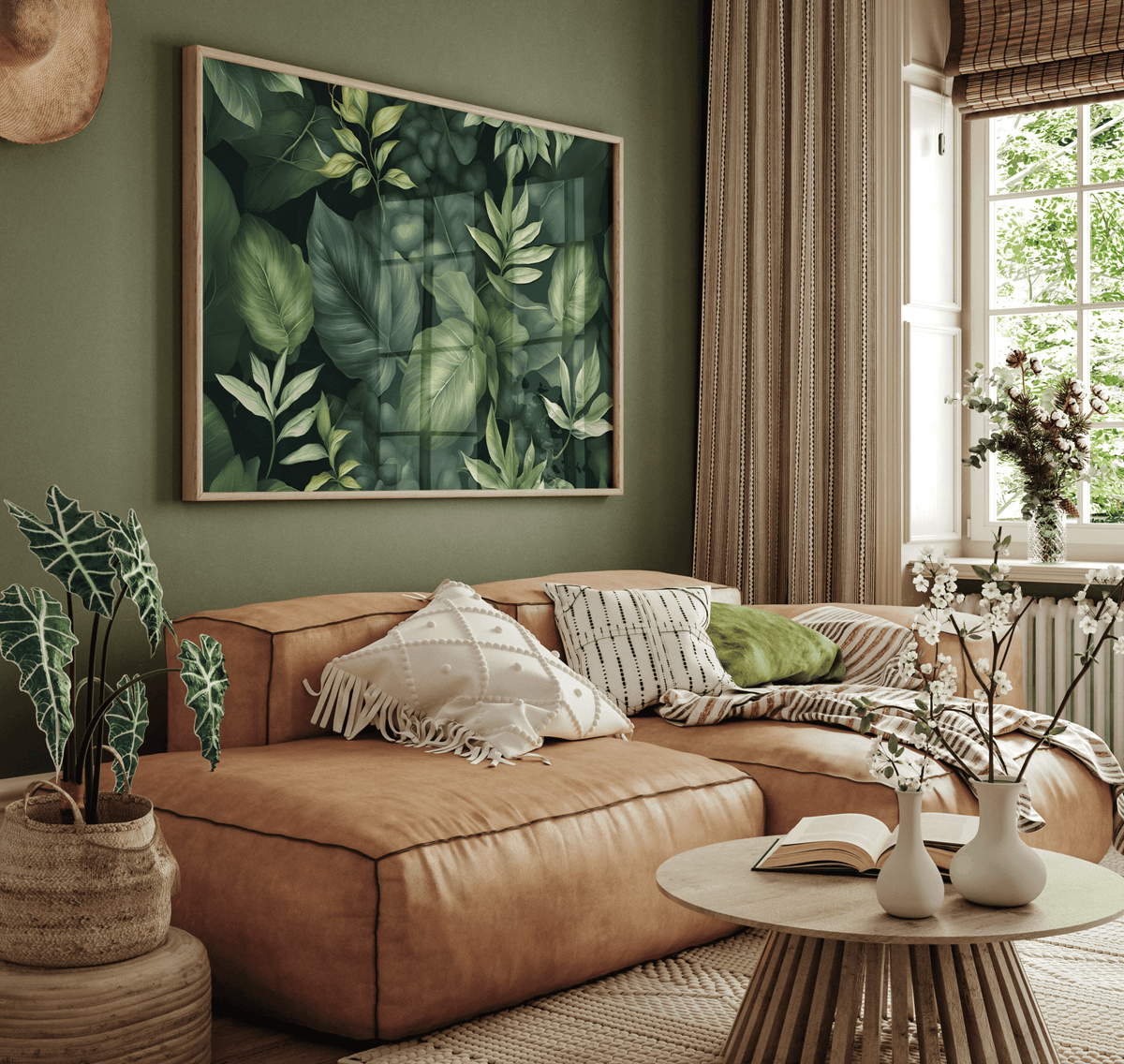 Dark green leaf print above a tan leather sofa in an earthy living room
