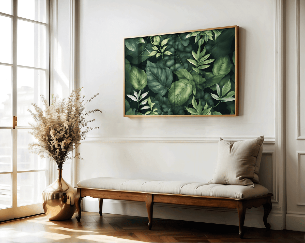 Dark green leaf wall art in a natural frame above a wooden bench with dried flowers