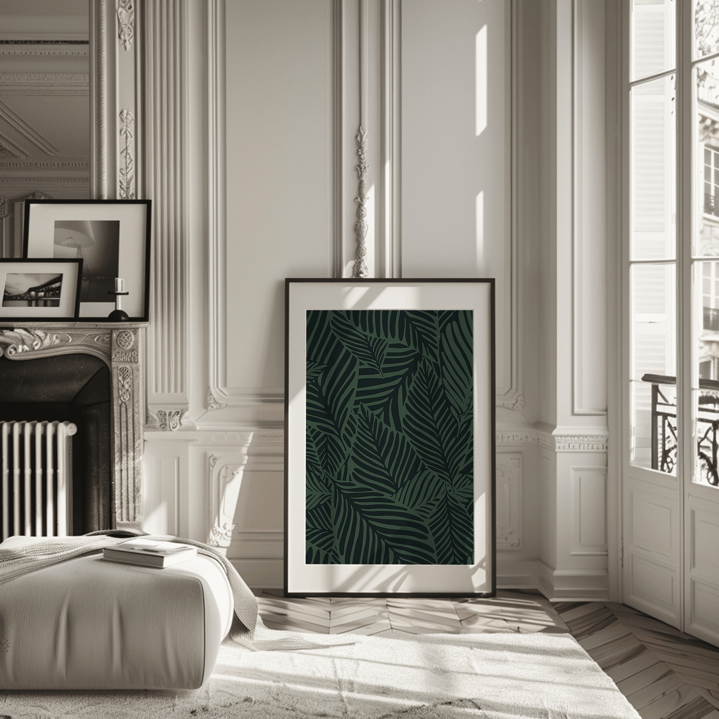 Dark green palm leaf botanical print in a black frame leaning in a classic Parisian apartment