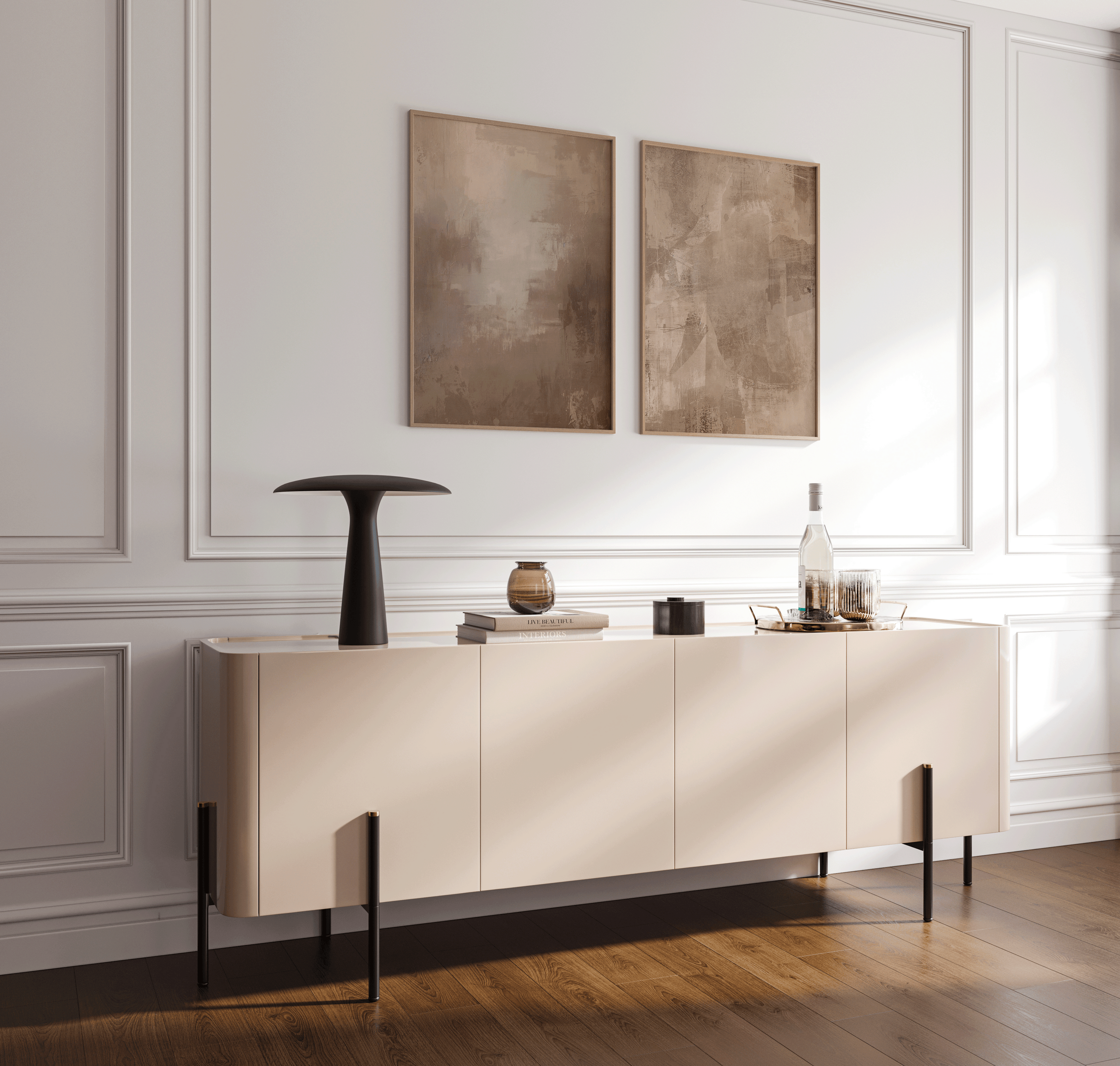 pair of earthy beige and brown abstract prints in wood frames styled above a minimalist console table in a bright entryway with paneled walls