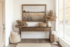 Vintage nature landscape canvas wall art framed above wooden console with seasonal fall decor