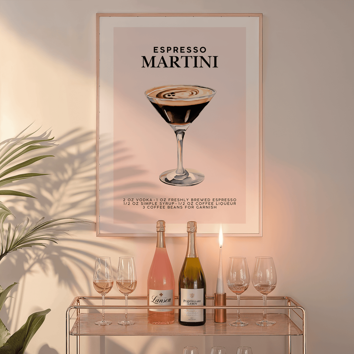 Espresso martini print in a natural wood frame above a glass bar cart with wine bottles and glasses