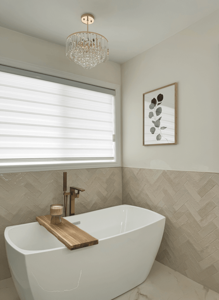 Eucalyptus wall art in an oak frame above a freestanding tub in a modern bathroom