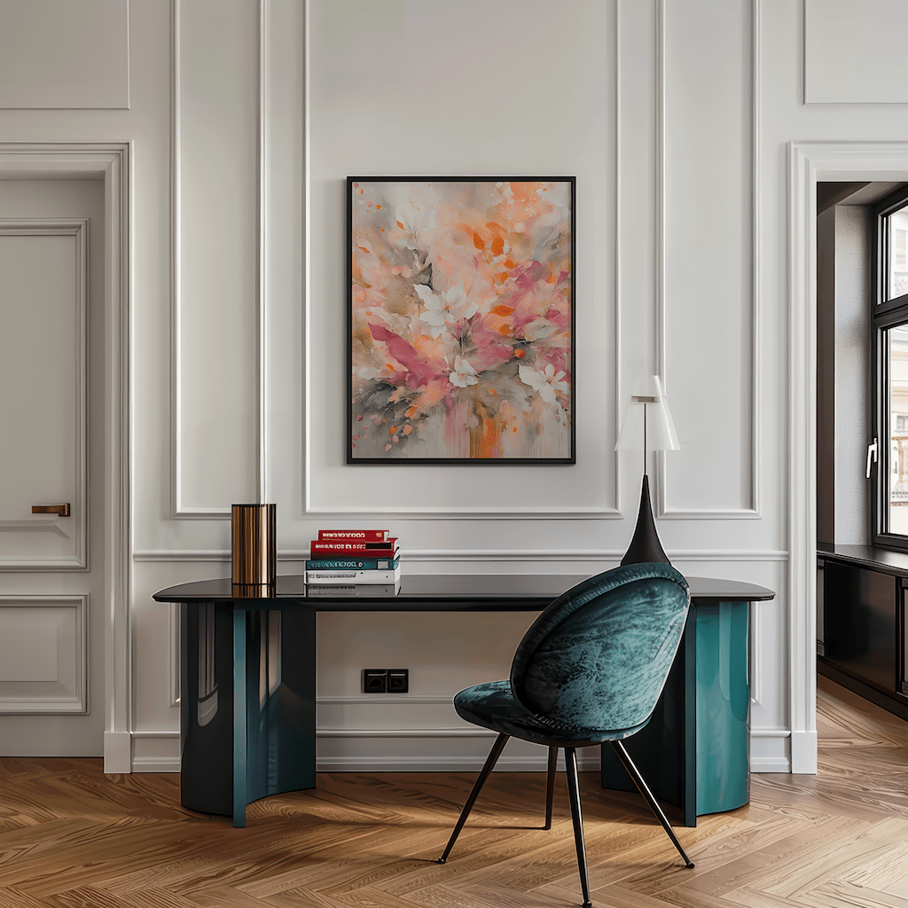 Framed pink and orange floral abstract print above a sleek home office desk