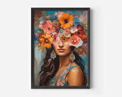 Flower crown wall art with a black frame of a South Asian woman with long brown wavy hair, a colorful floral headpiece, gold and blue embellished hanging earrings, and warm tones in blue, orange, pink, purple, and red.