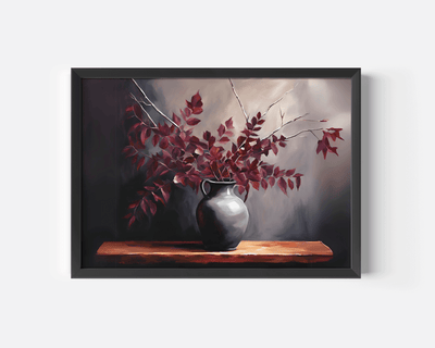 Close-up of a black framed artwork of a vase with red leaves on a wooden shelf against a dark background, rustic, vintage botanical print