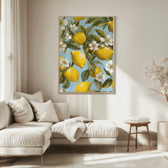 Lemon canvas wall art framed in wood above a neutral sectional sofa in a cozy living room with natural light