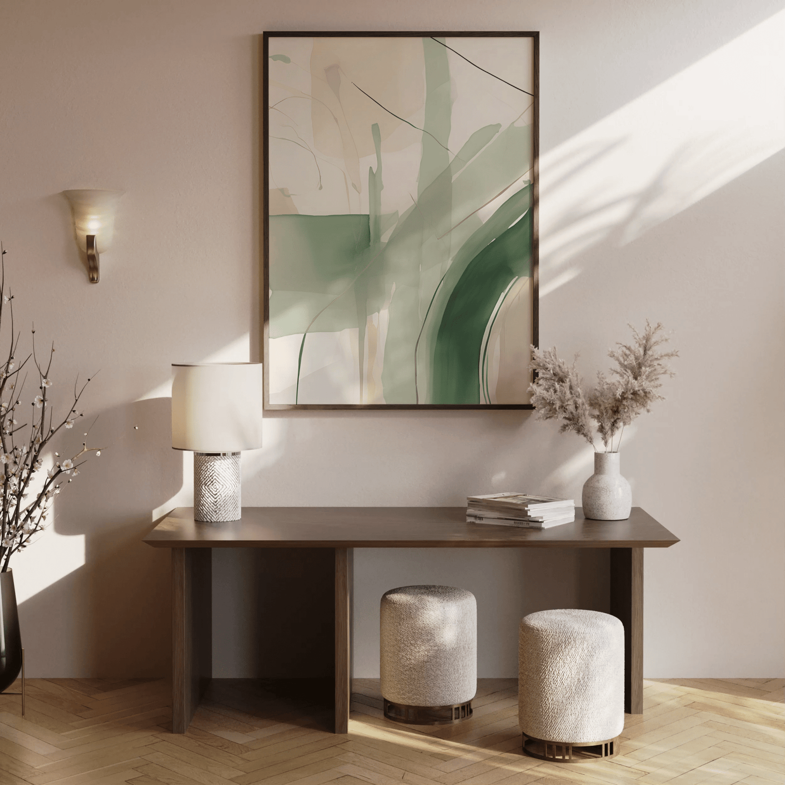 Modern watercolor abstract wall art in soft green hues, creams and beige tones with lines and layered design. The artwork has a brown wooden frame and is placed above a brown wooden console table with decorative accents in an entryway or hallway.