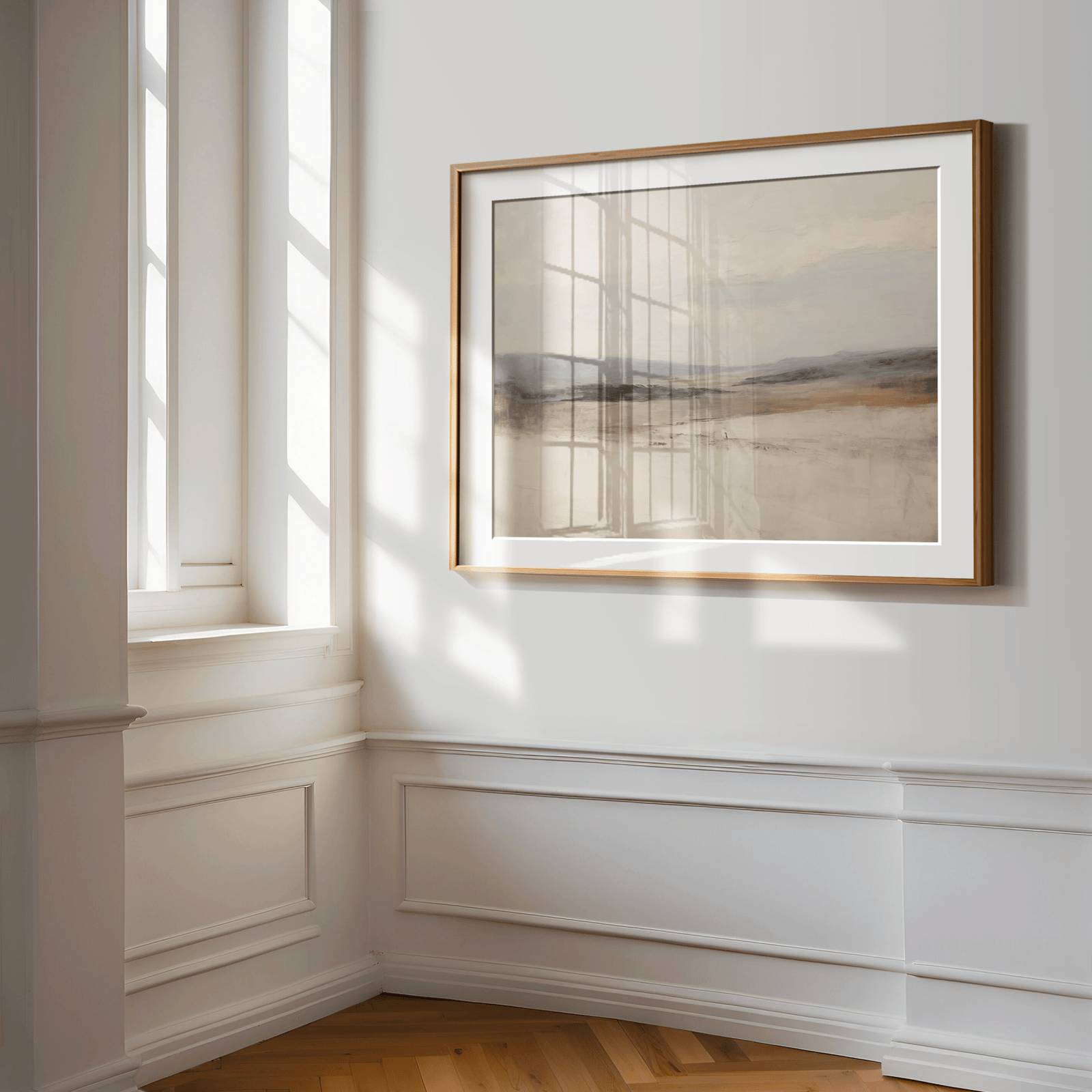 Framed Abstract Landscape Wall Art in Neutral muted Tones Displayed on White Wall in a hallway with wainscotting