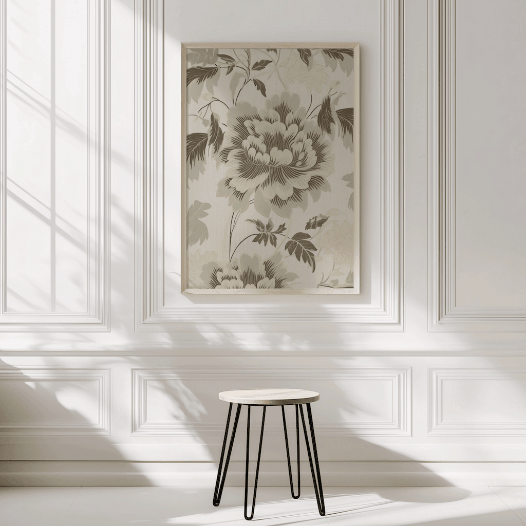 Neutral green beige floral botanical wall art framed hanging above table in bright sunlit room with white walls