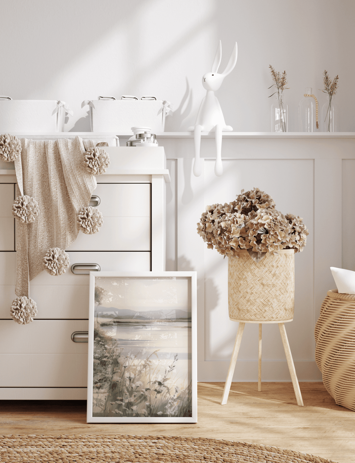 Neutral nature wall art styled in nursery with soft decor and white wooden furniture