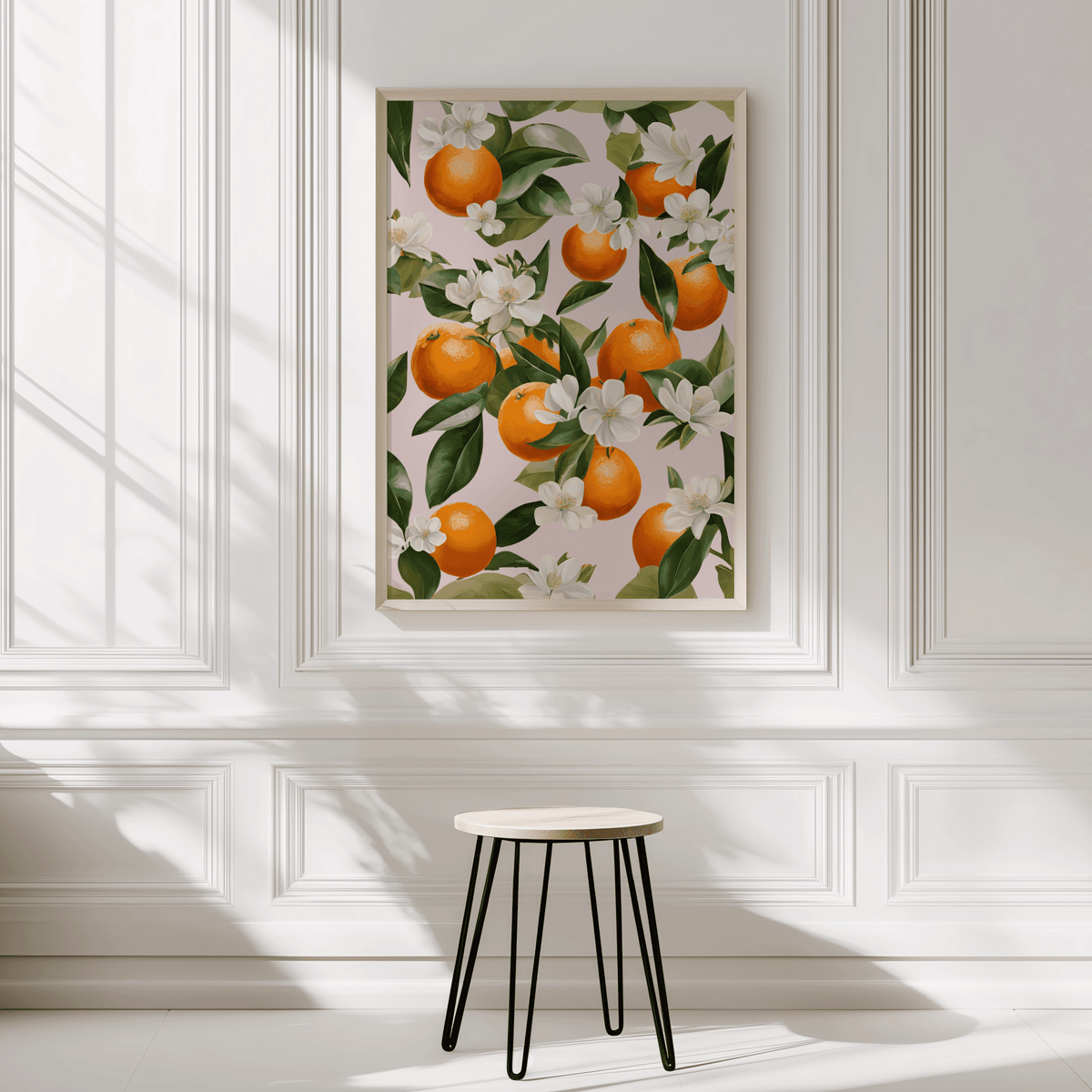 Orange blossom print framed in a sunlit room with a minimalist white interior