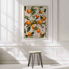 Orange blossom print framed in a sunlit room with a minimalist white interior
