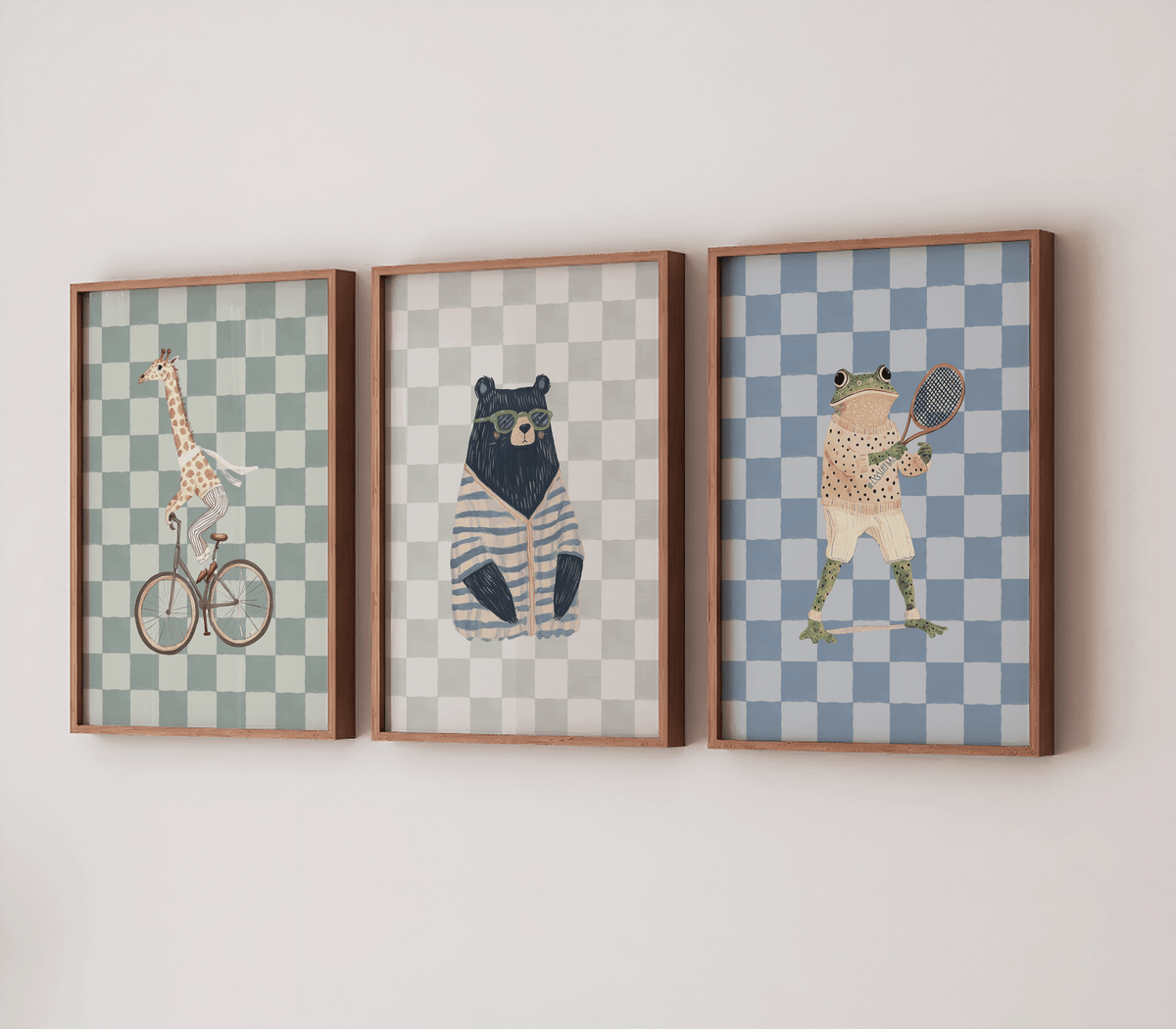 Set of 3 vintage, safari-themed animal prints including giraffe, bear, and frog on a white wall