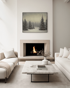 Framed pine tree forest print above a stone fireplace in a neutral living room with white couches