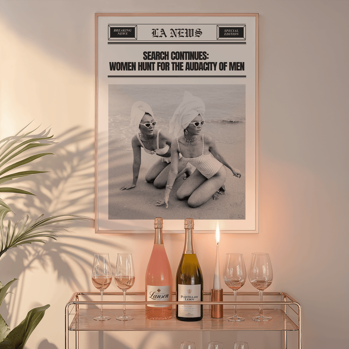 Funny newspaper print in a natural frame above a glass bar cart with wine bottles and a candle