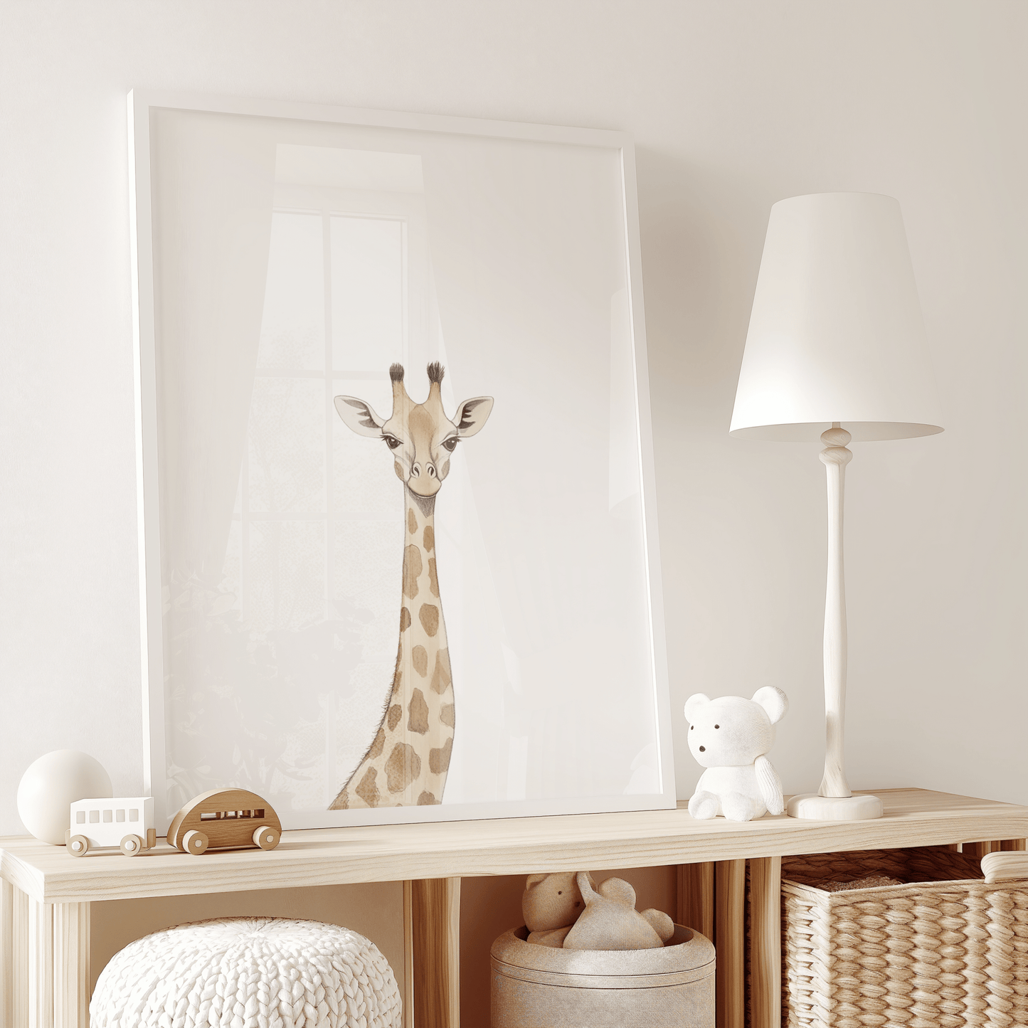 Neutral giraffe canvas wall art print with a white frame styled on wooden shelf in nursery