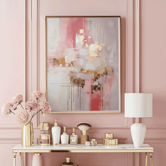 Gold metallic, creamy white and pink abstract wall art with a gold frame on a pink wall above a makeup vanity with flowers in a vase. Beautiful, feminine contemporary abstract art perfect for any modern space.