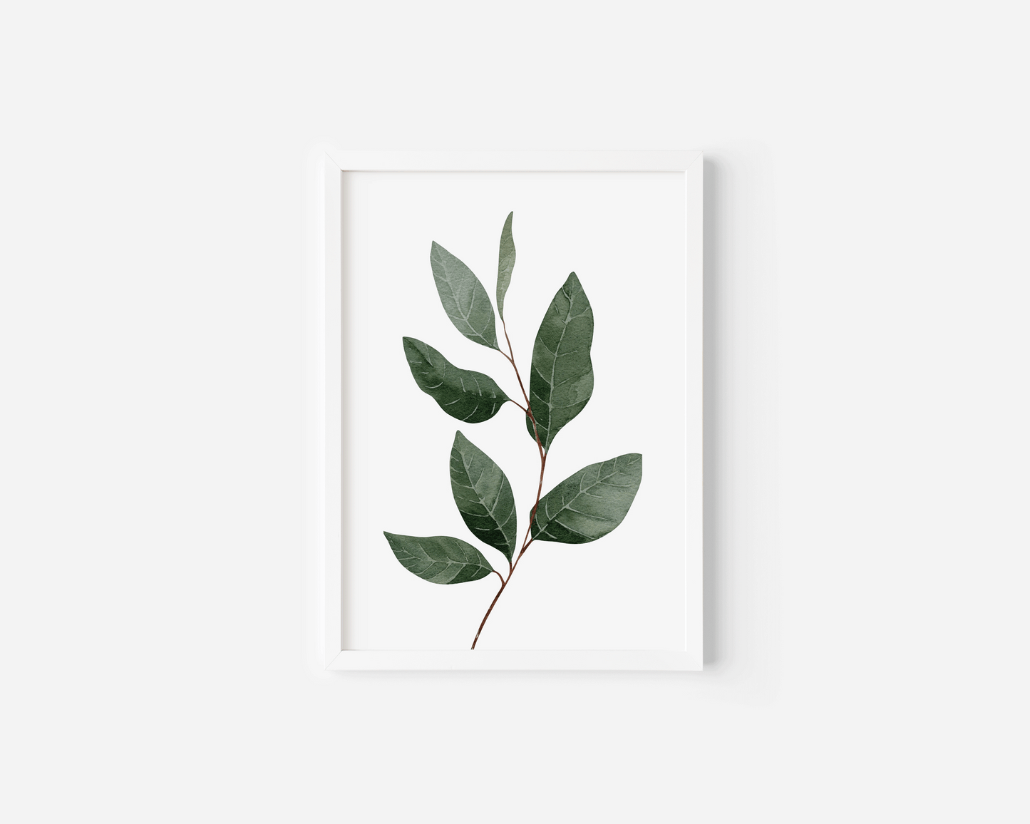 Green leaf wall art in a white frame, watercolour botanical branch with veined leaves