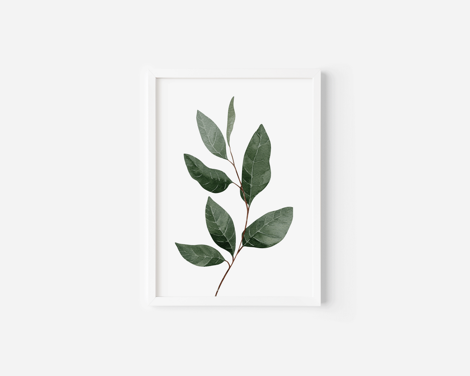 Green leaf wall art in a white frame, watercolour botanical branch with veined leaves