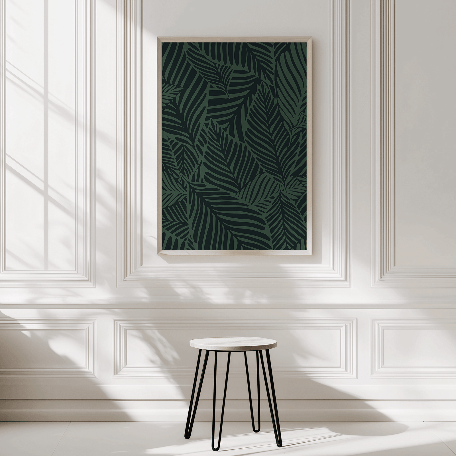 Green tropical botanical wall art in a natural wood frame on a panelled entryway wall
