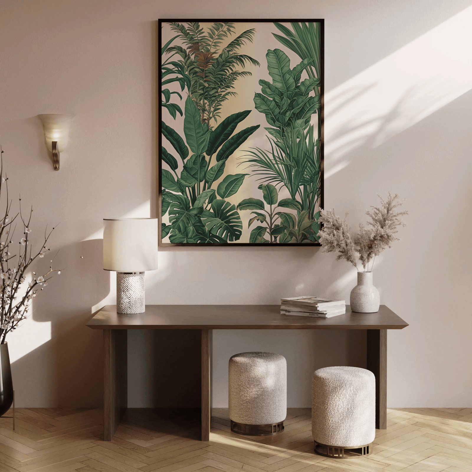 Green tropical leaf wall art in a wood frame above a console table in a sunlit entryway