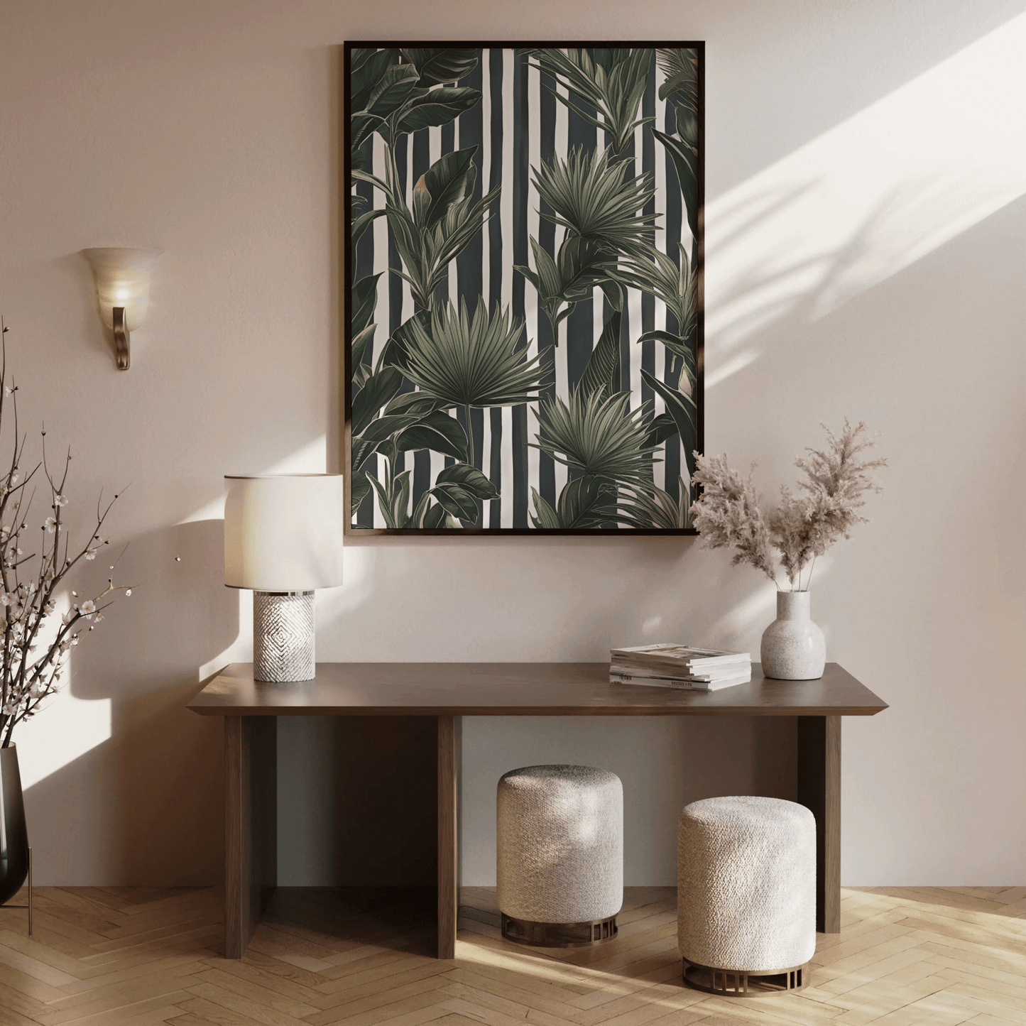 Green tropical palm wall art in a wood frame above a console table in a sunlit entryway